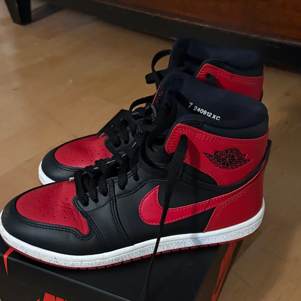Nike Air Jordan 1 High in Black and Red